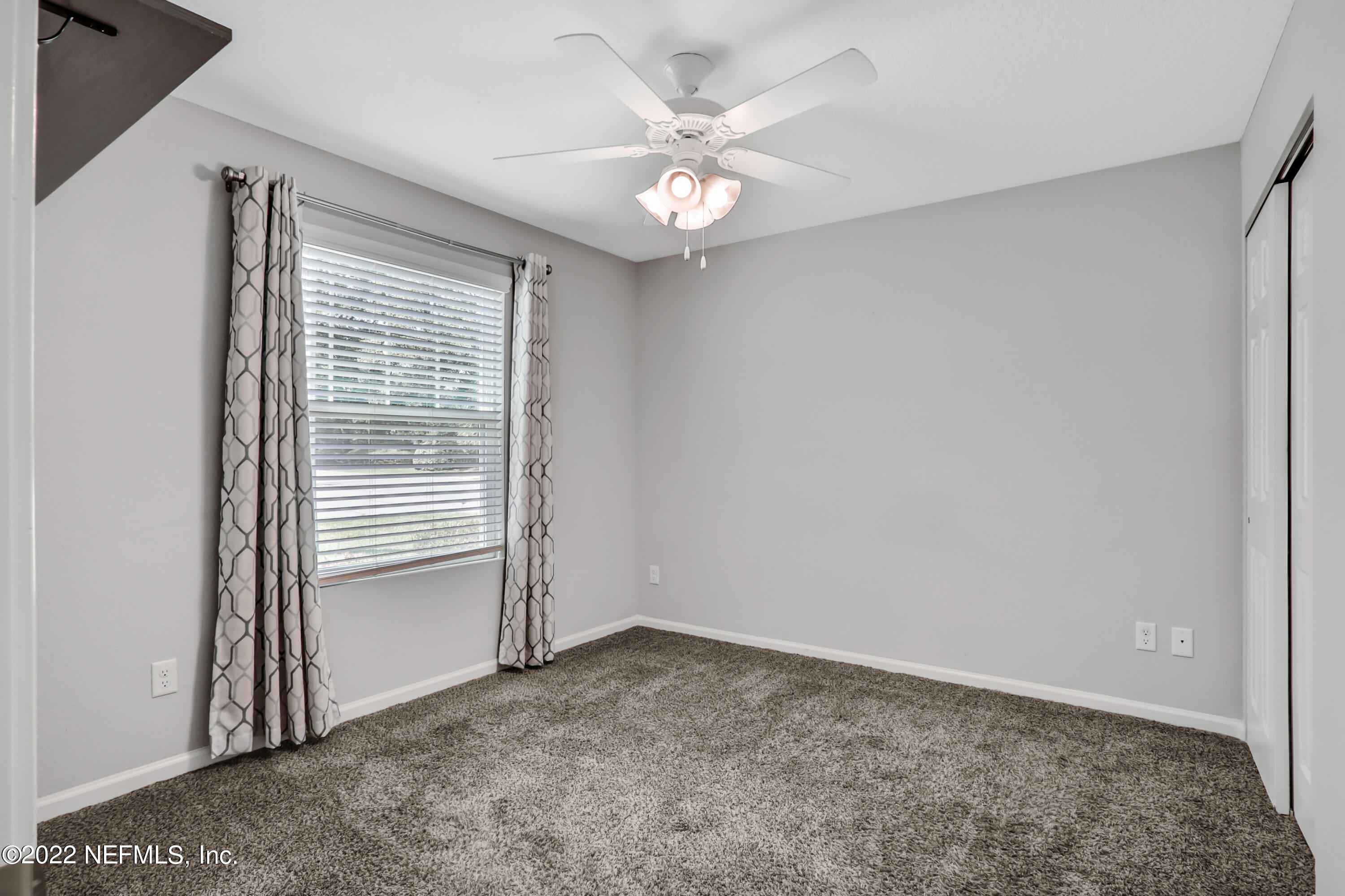 7507 Hilsdale Road Jacksonville, FL 32216 - Photo 23 of 38 an empty room with a window