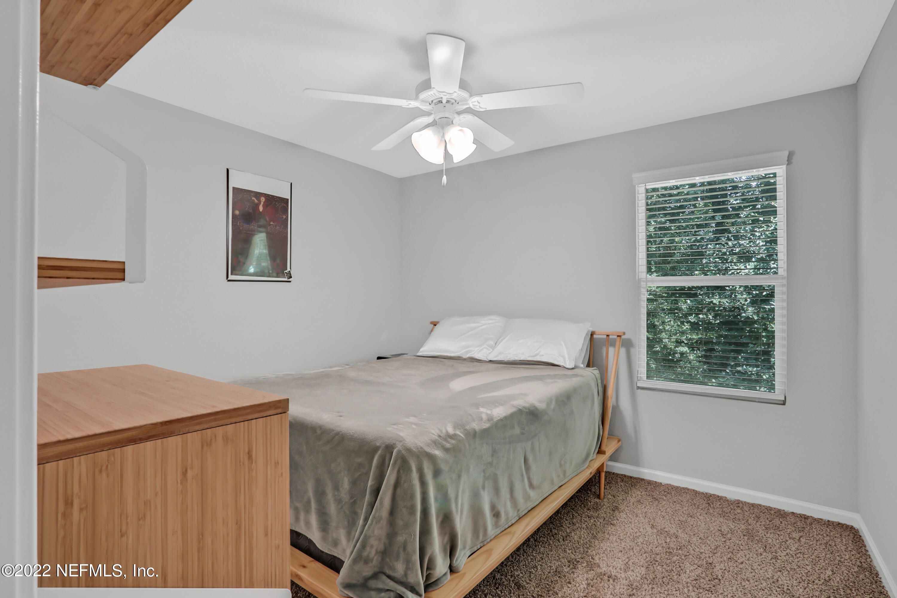 7507 Hilsdale Road Jacksonville, FL 32216 - Photo 25 of 38 a bedroom with a bed and a window