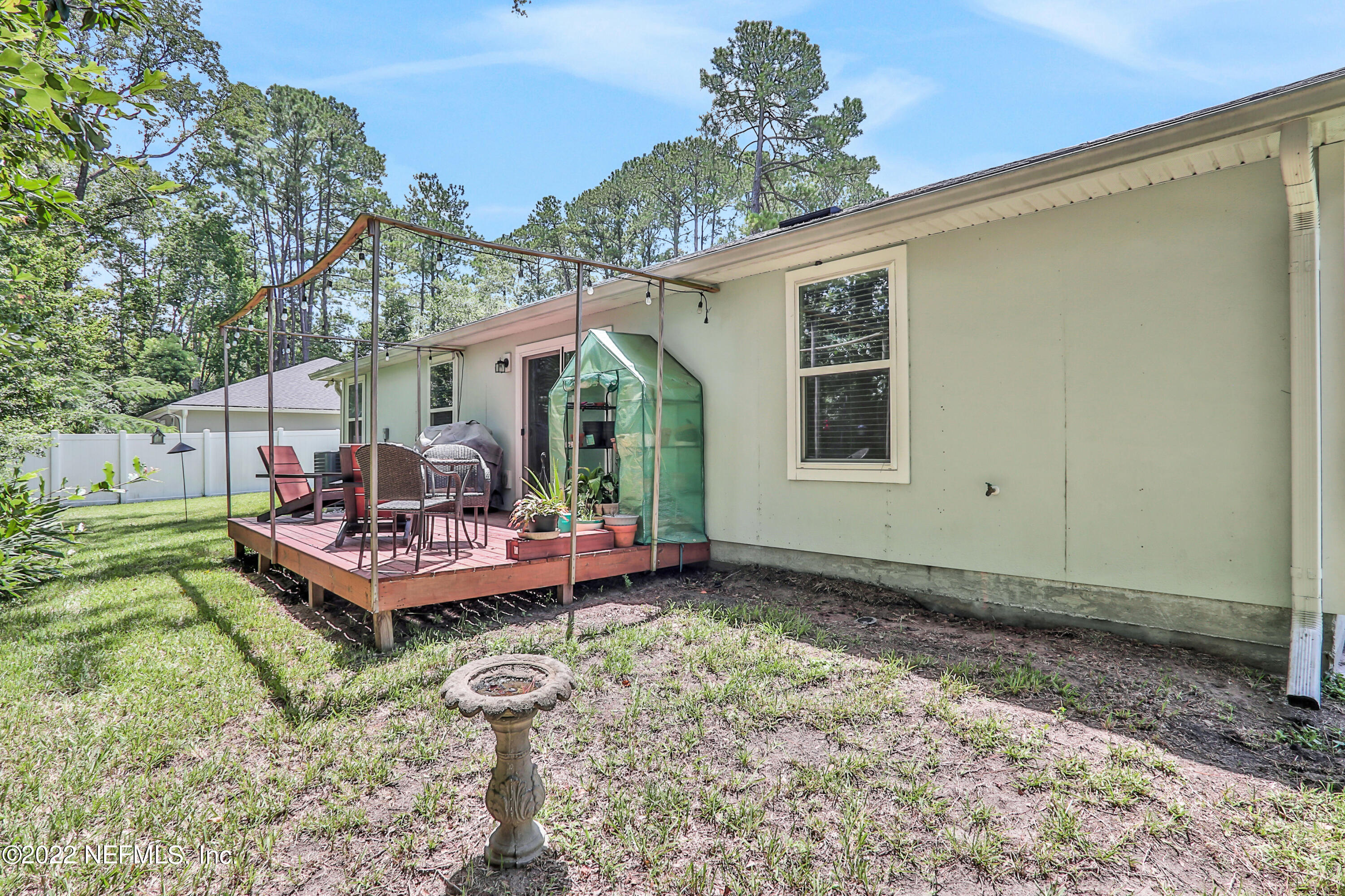 7507 Hilsdale Road Jacksonville, FL 32216 - Photo 36 of 38 a front view of a house with a yard table and chairs