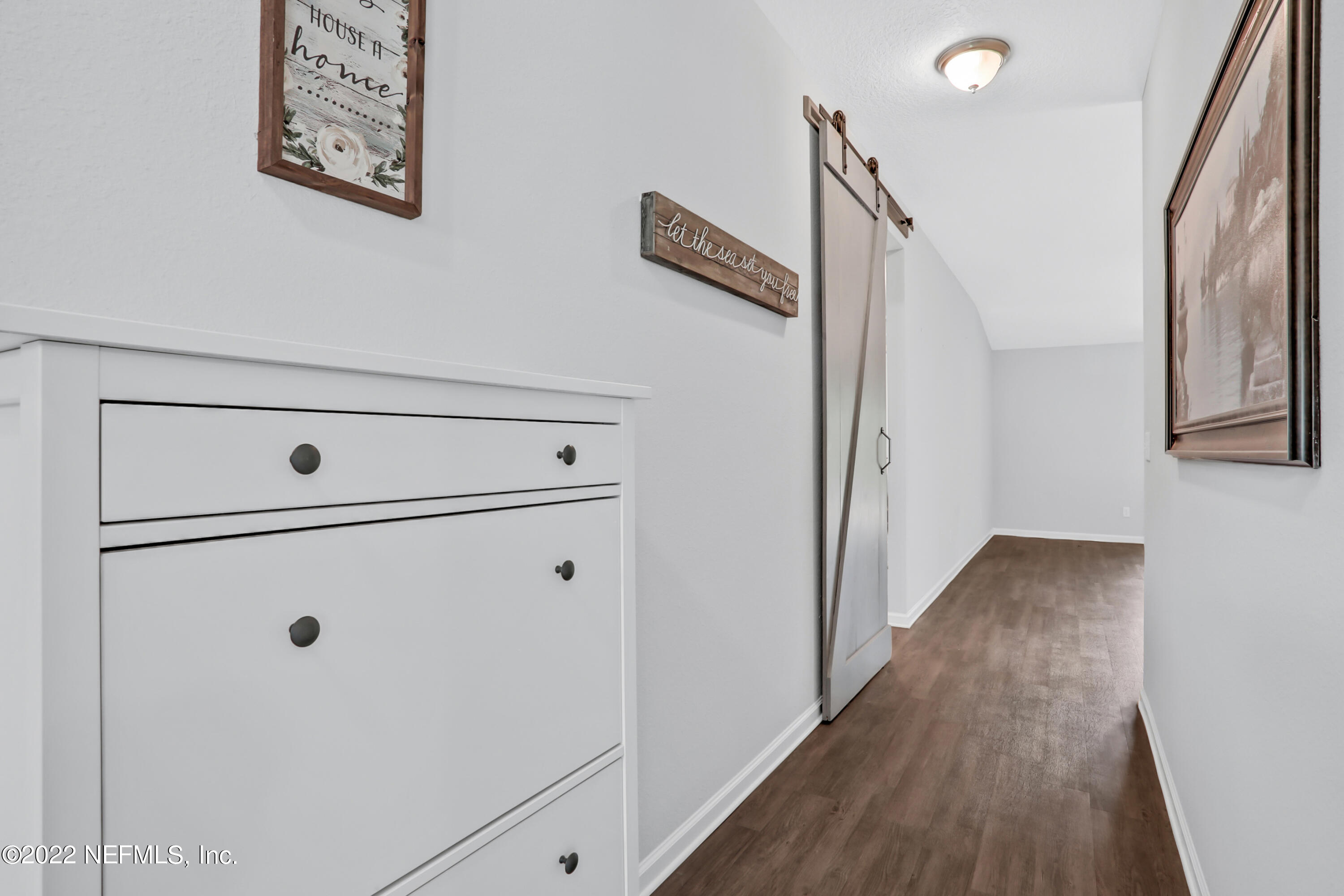 7507 Hilsdale Road Jacksonville, FL 32216 - Photo 4 of 38 a view of a hallway with wooden floor