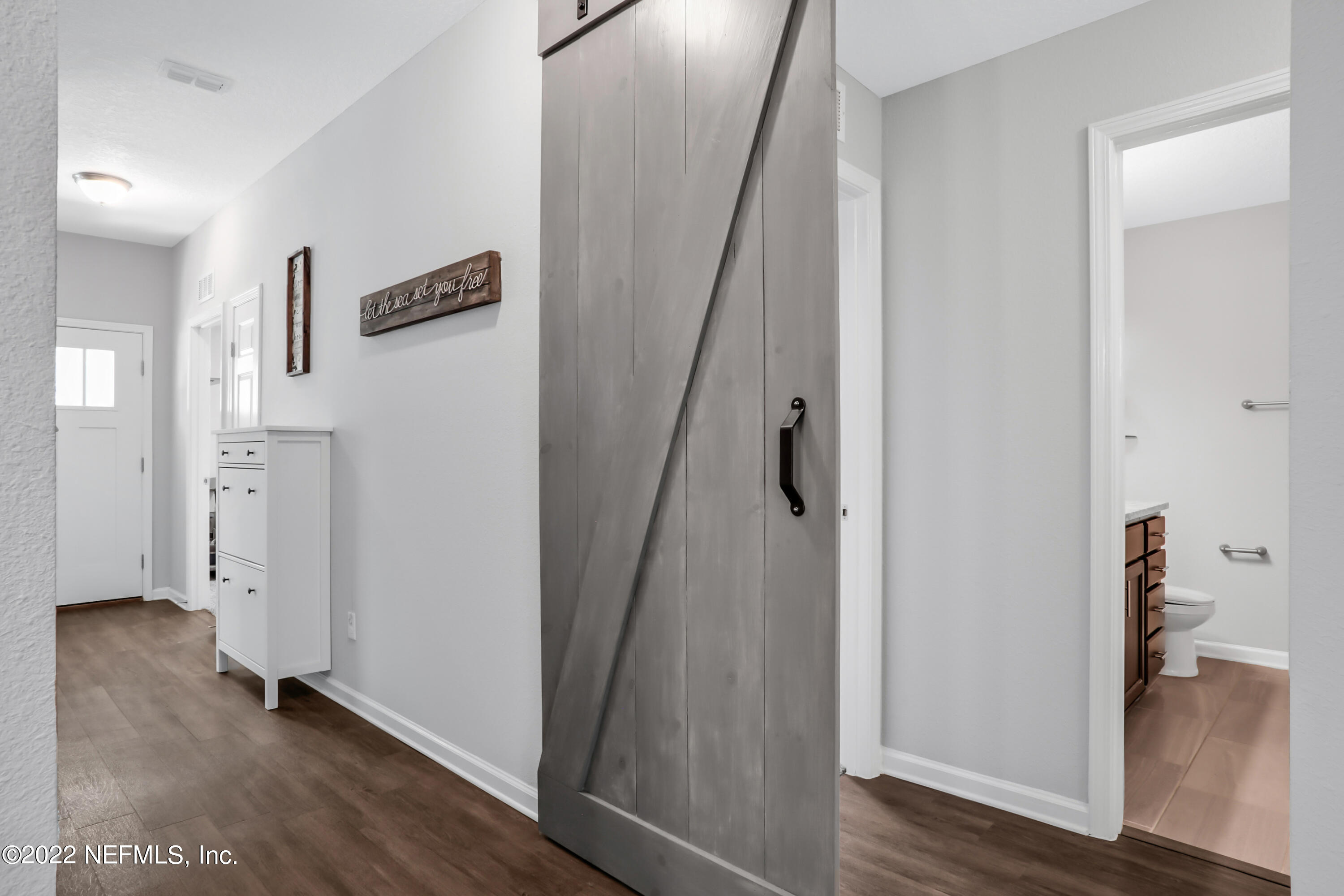 7507 Hilsdale Road Jacksonville, FL 32216 - Photo 5 of 38 a view of hallway with wooden floor