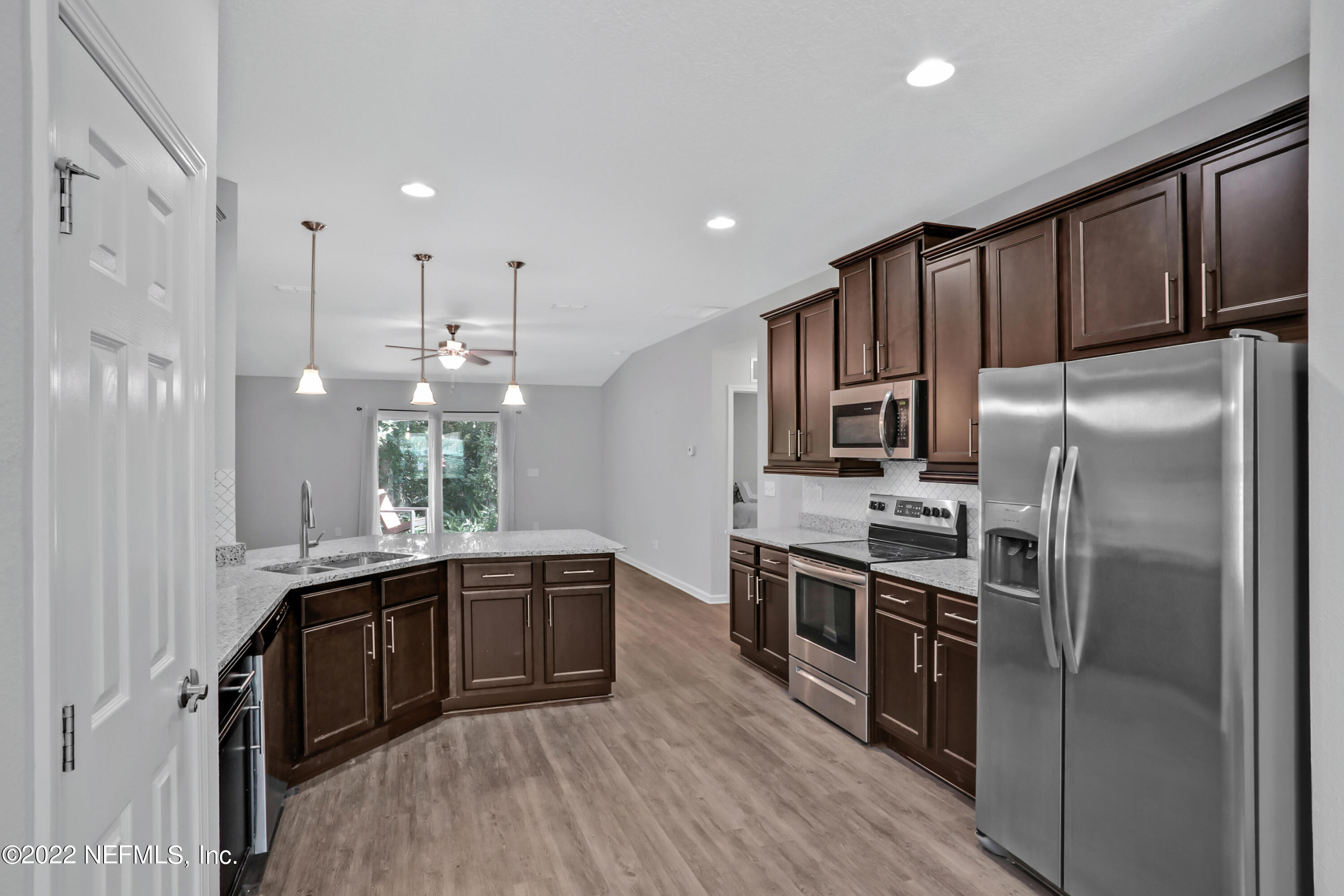 7507 Hilsdale Road Jacksonville, FL 32216 - Photo 6 of 38 a kitchen with stainless steel appliances granite countertop a sink a stove and refrigerator