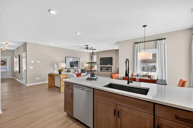 a kitchen with sink and view living room