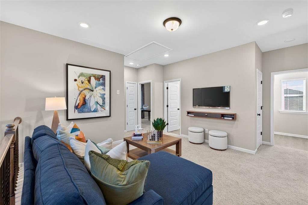 114 Andros Loop Dalton, GA 30721 - Photo 20 of 41 a living room with furniture and a flat screen tv