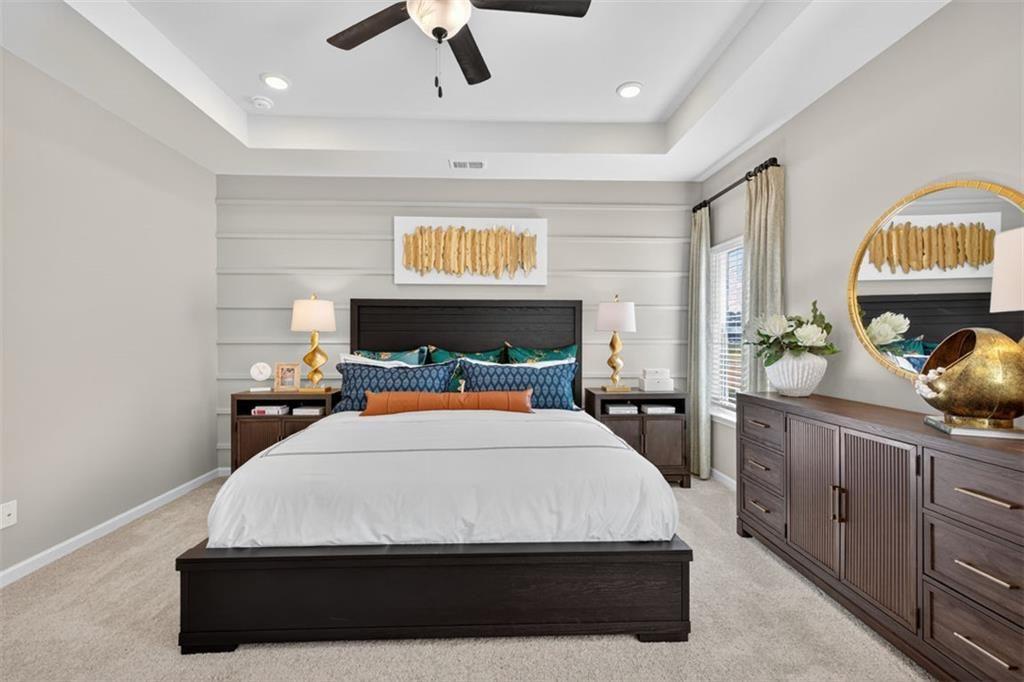 114 Andros Loop Dalton, GA 30721 - Photo 32 of 41 a bedroom with a bed and a dresser