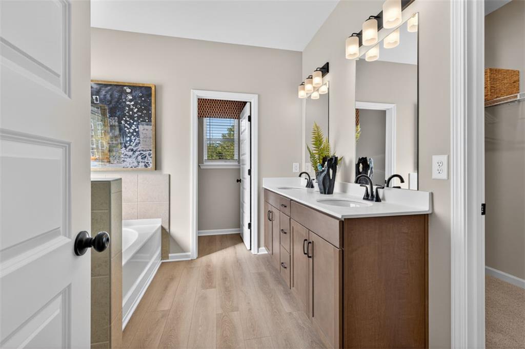 114 Andros Loop Dalton, GA 30721 - Photo 33 of 41 a spacious bathroom with a double vanity sink mirror and shower