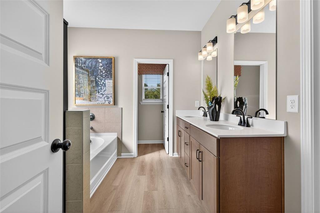 114 Andros Loop Dalton, GA 30721 - Photo 34 of 41 a spacious bathroom with a sink mirror and a shower