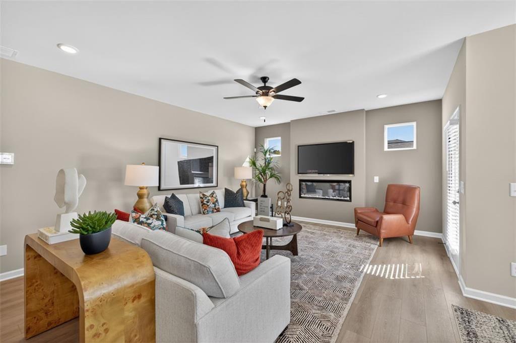 114 Andros Loop Dalton, GA 30721 - Photo 6 of 41 a living room with furniture and a flat screen tv
