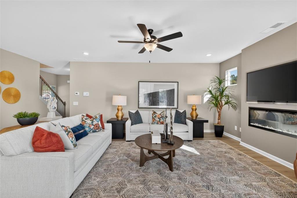 114 Andros Loop Dalton, GA 30721 - Photo 7 of 41 a living room with furniture and a flat screen tv