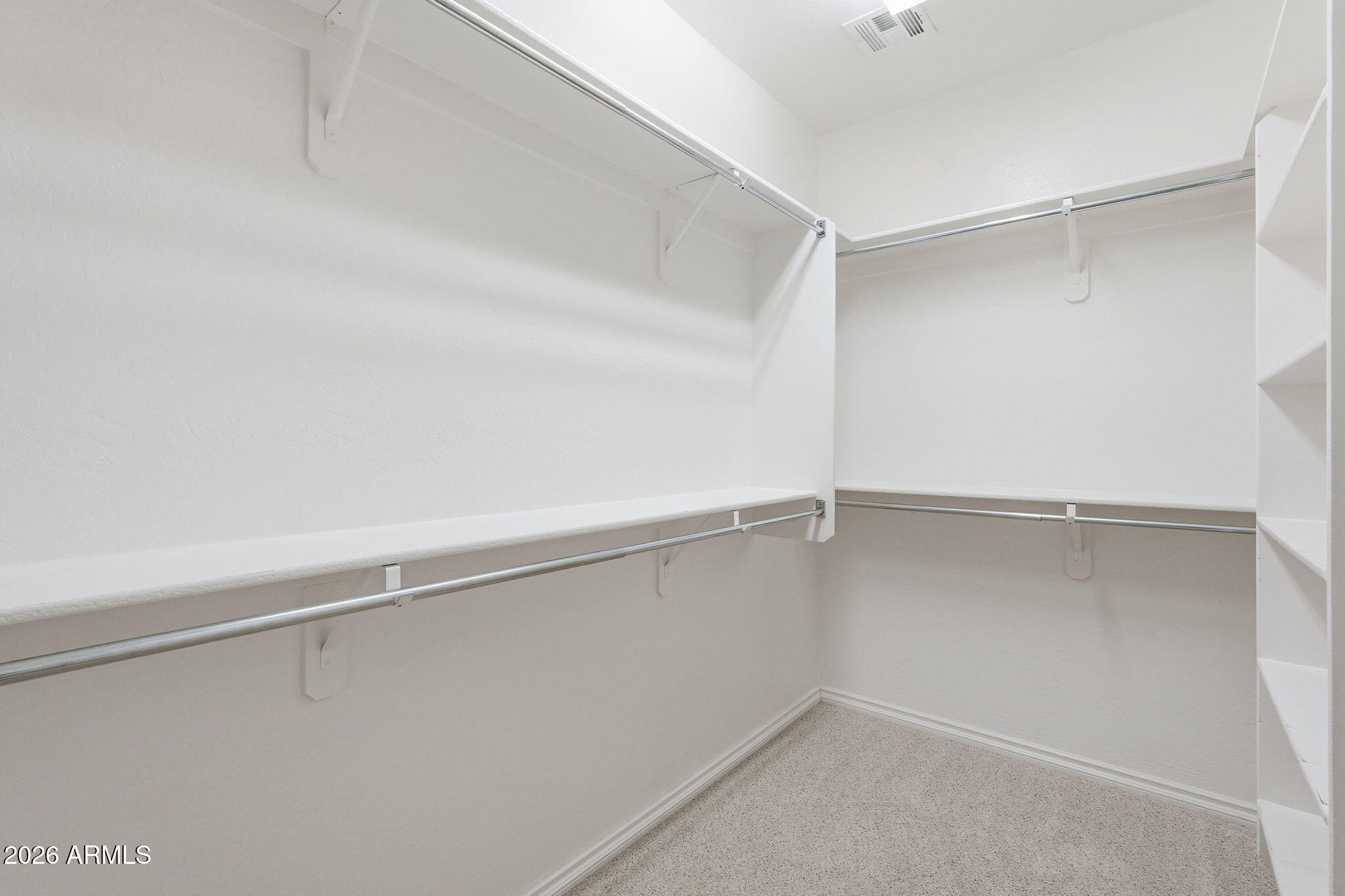 1694 East Grand Ridge Road Queen Creek, AZ 85140 - Photo 31 of 61 a view of an empty walk in closet