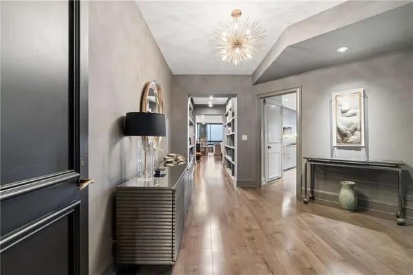a view of a hallway view with wooden floor and staircase