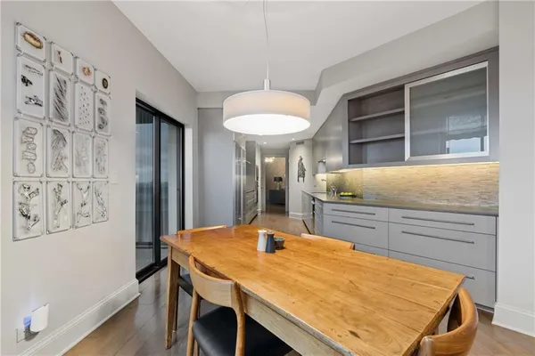 a kitchen with a table and chairs