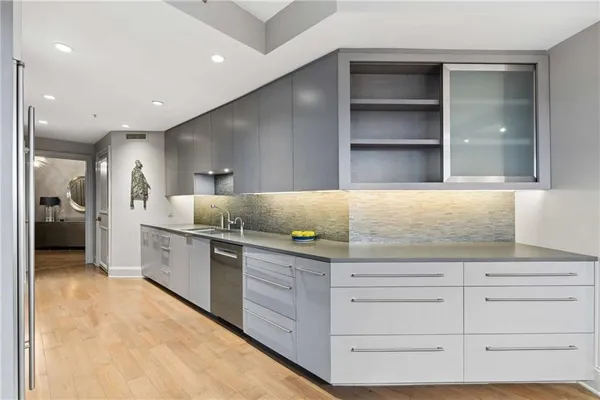 a kitchen with granite countertop cabinets and window