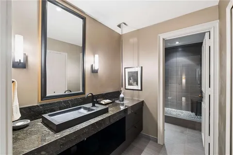 a bathroom with a sink and a mirror
