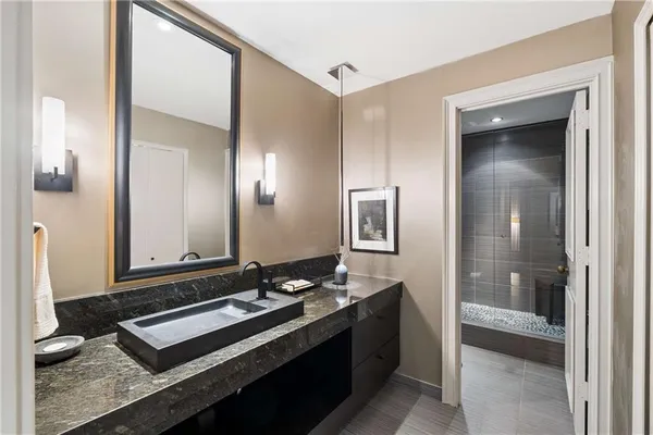 a bathroom with a sink and a mirror