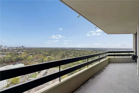 a view of swimming pool with outdoor seating