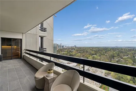 a view of a balcony with furniture
