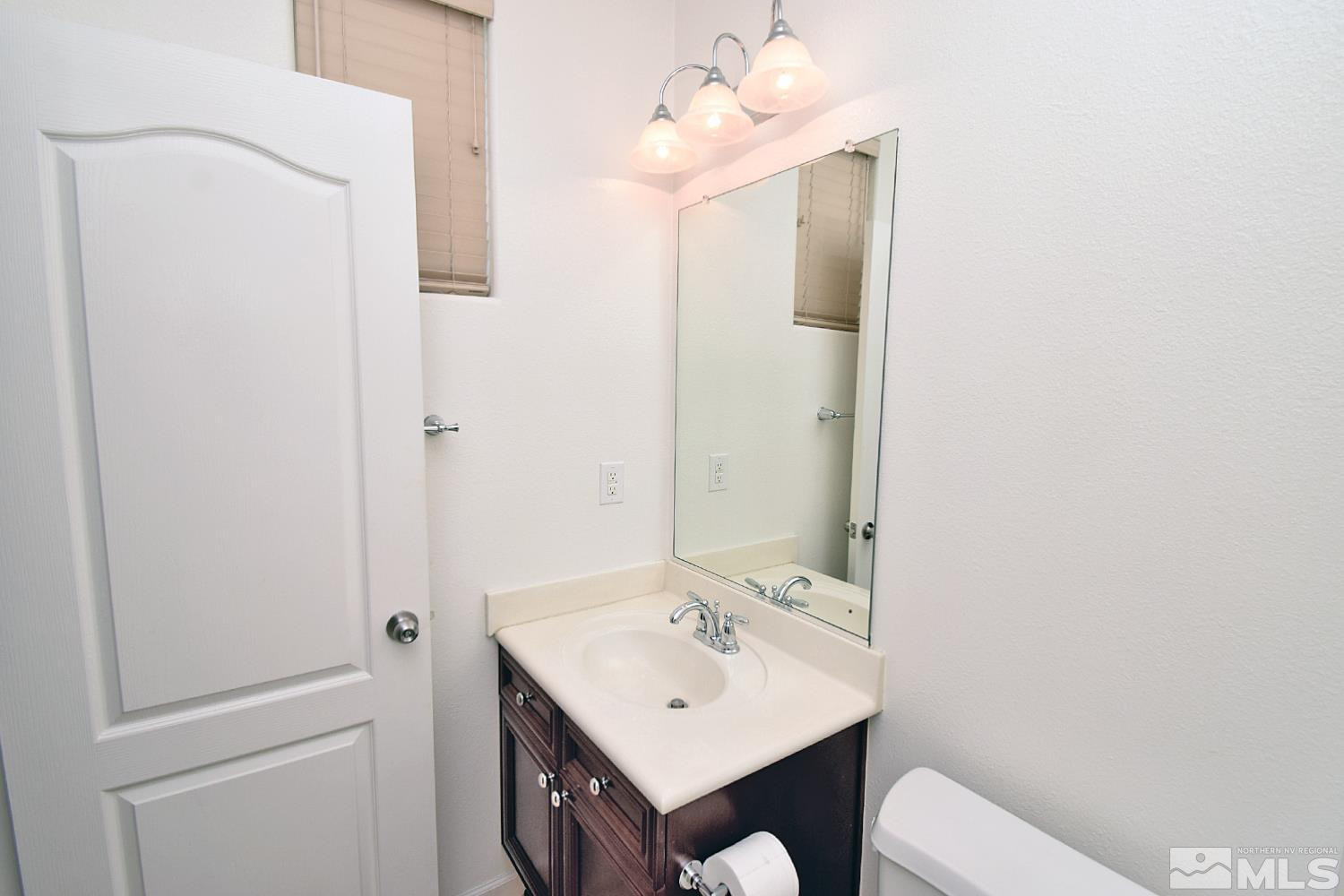 1955 Angel Ridge Drive Reno, NV 89521 - Photo 15 of 33 a bathroom with a sink a toilet and mirror