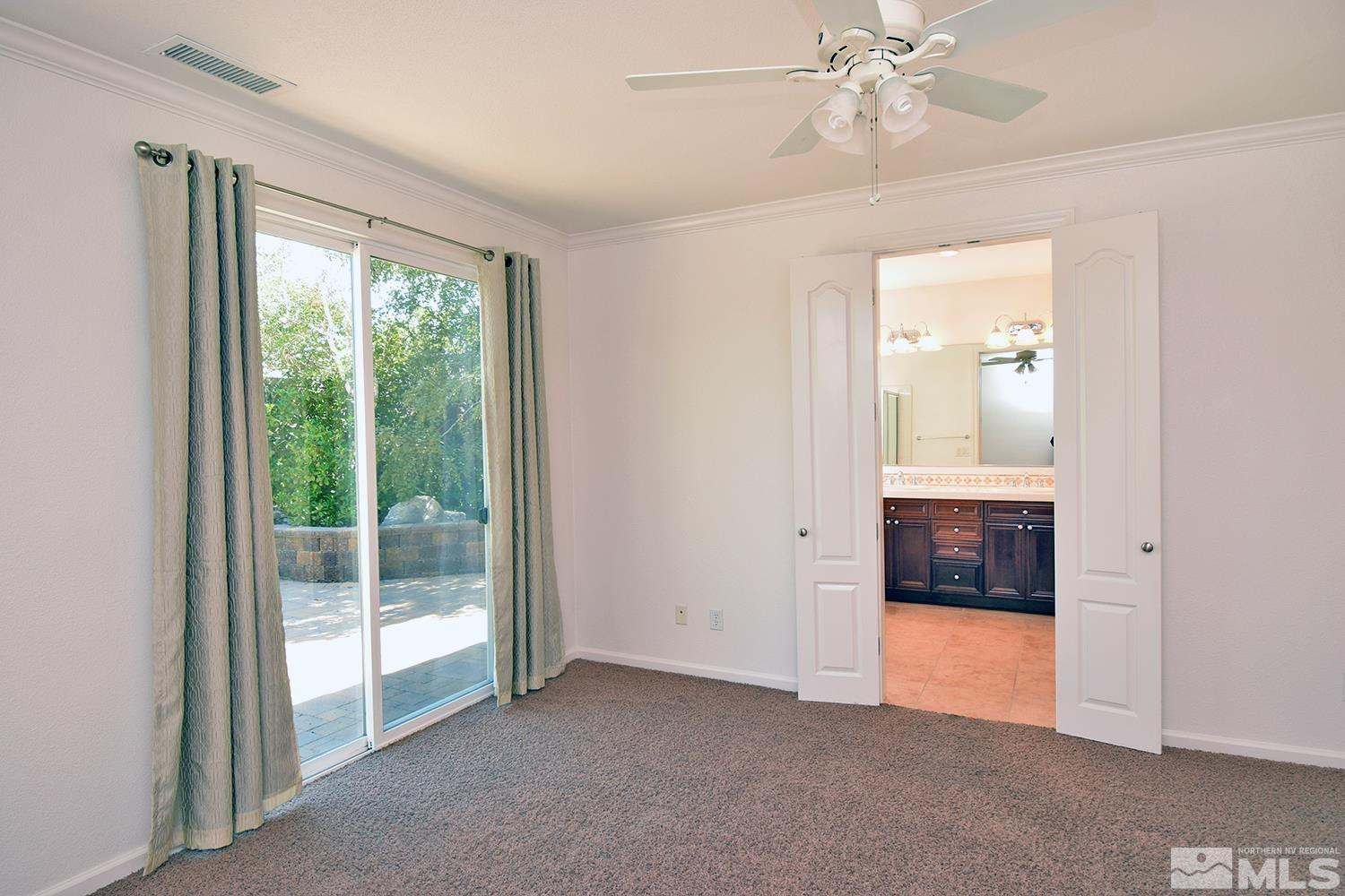 1955 Angel Ridge Drive Reno, NV 89521 - Photo 18 of 33 an empty room with fan and windows