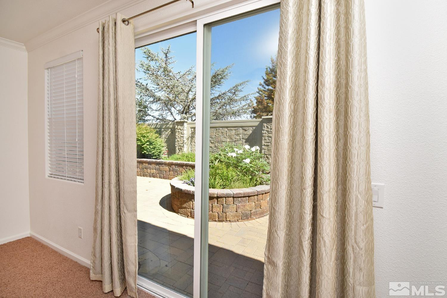 1955 Angel Ridge Drive Reno, NV 89521 - Photo 19 of 33 a view of a glass door with a balcony from a window