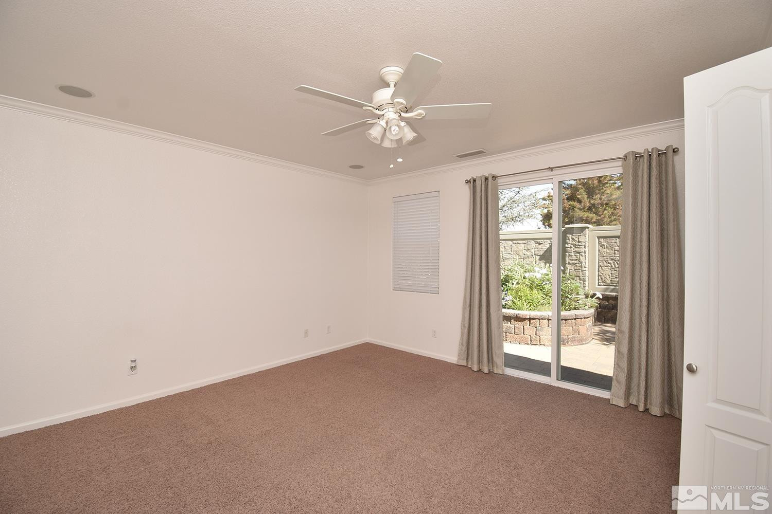 1955 Angel Ridge Drive Reno, NV 89521 - Photo 20 of 33 an empty room with windows and fan