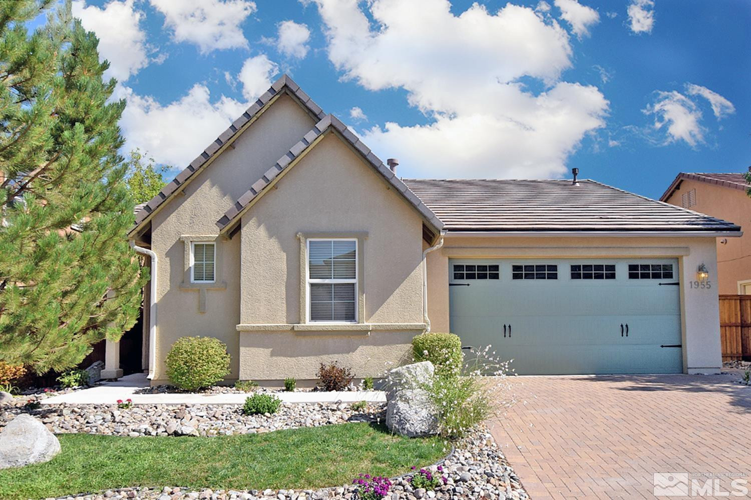 1955 Angel Ridge Drive Reno, NV 89521 - Photo 2 of 33 a front view of a house with a yard
