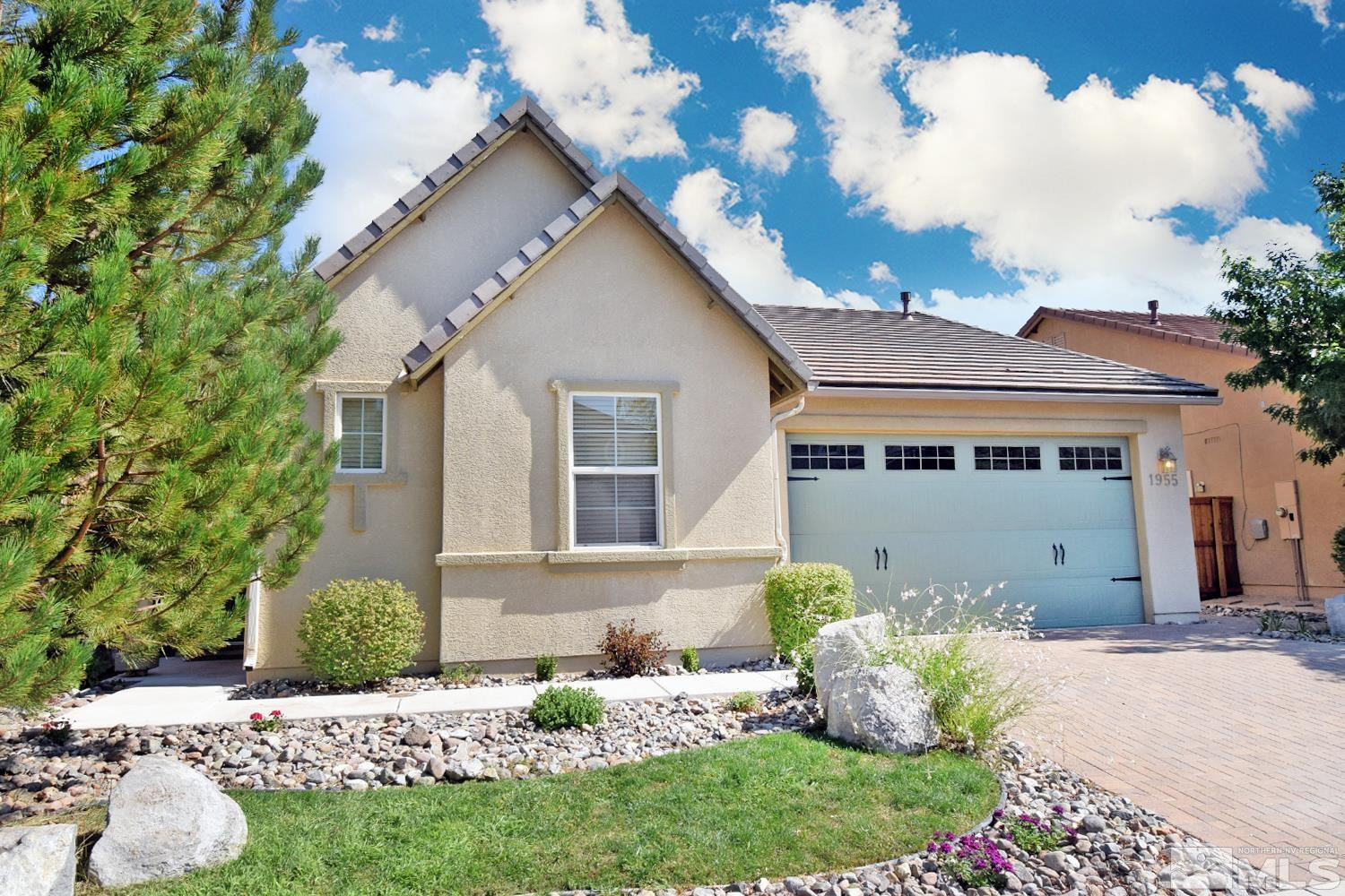 1955 Angel Ridge Drive Reno, NV 89521 - Photo 3 of 33 a front view of a house with a yard