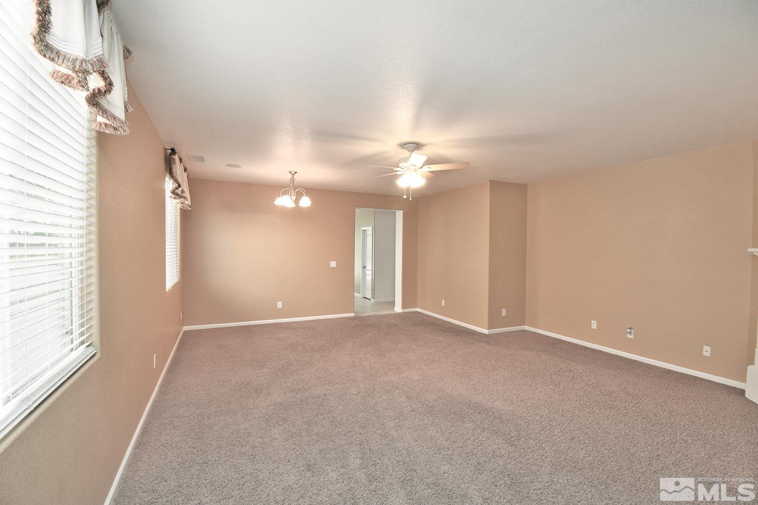 1955 Angel Ridge Drive Reno, NV 89521 - Photo 6 of 33 a view of an empty room with a chandelier fan
