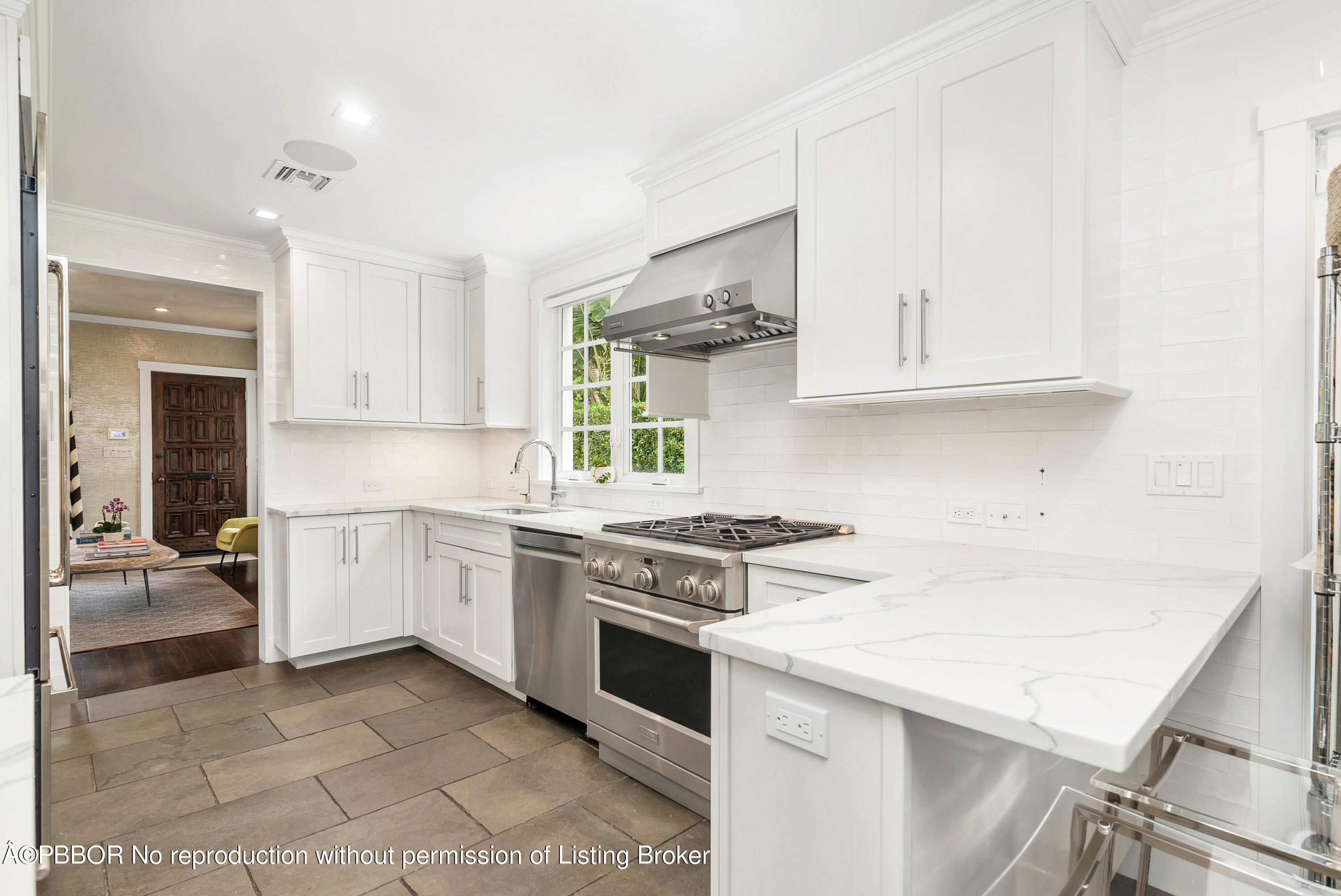 231 Sunset Road West Palm Beach, FL 33401 - Photo 9 of 22 a kitchen with a stove a sink and a refrigerator