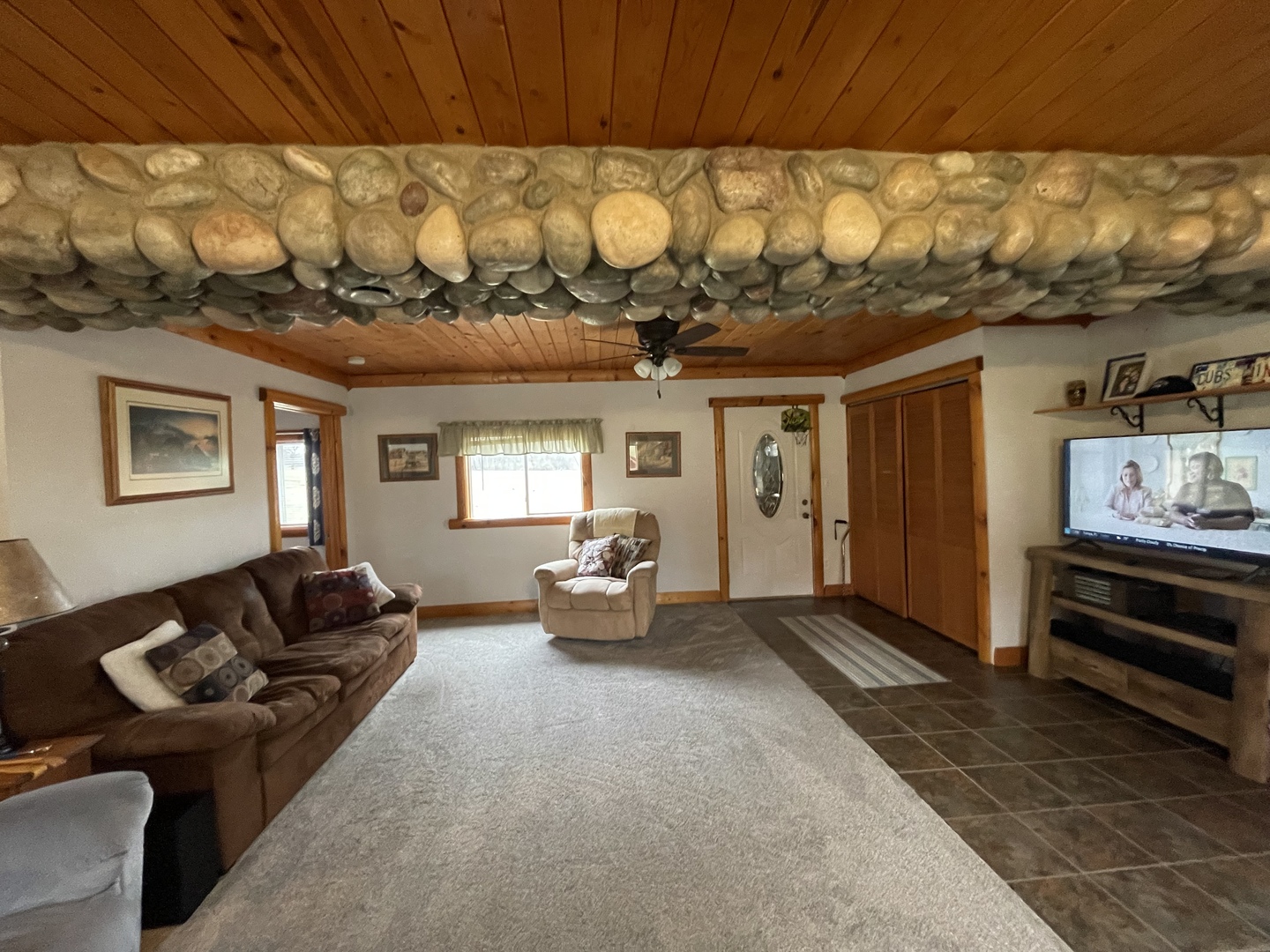 556 Dry Gulch Road Amboy, IL 61310 - Photo 12 of 23 a living room with furniture and a chandelier