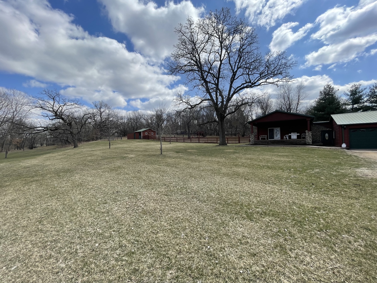 556 Dry Gulch Road Amboy, IL 61310 - Photo 23 of 23 a view of a outdoor space with lots of swings and slides