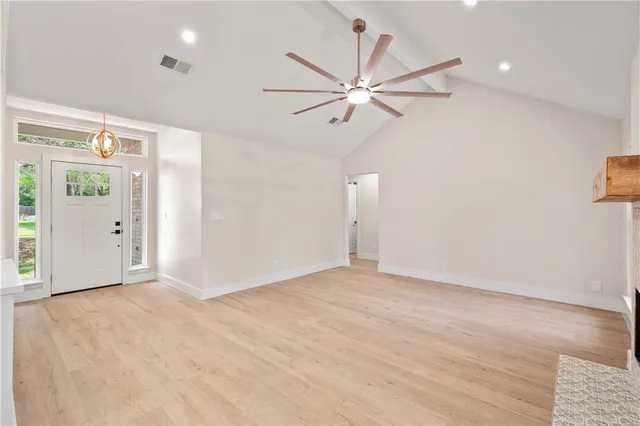 an empty room with fan and a ceiling fan