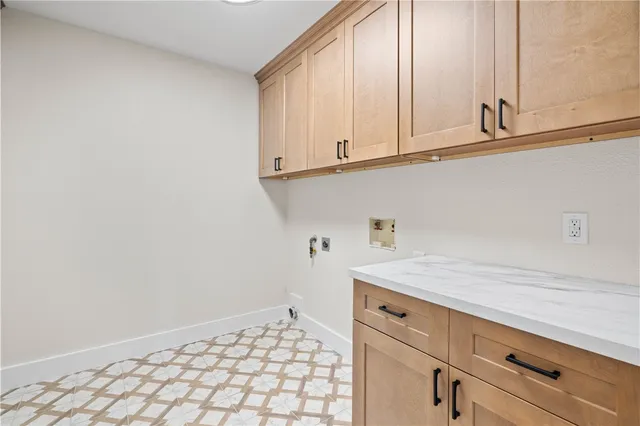 a kitchen with white cabinets and a sink