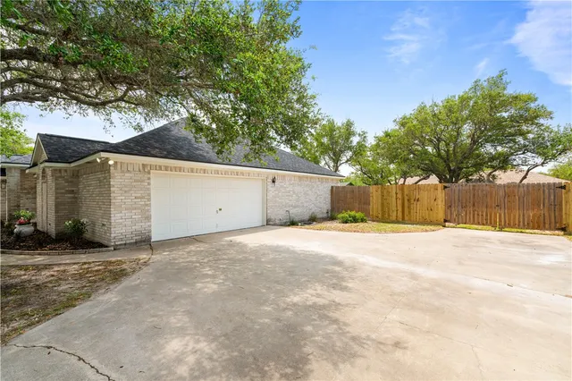 a view of a backyard of a house