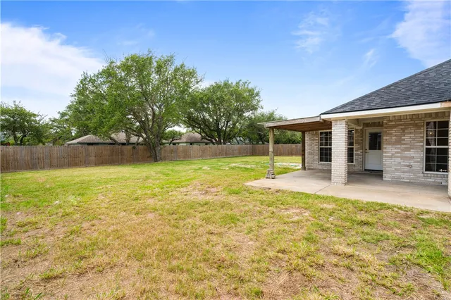 swimming pool with outdoor seating and yard