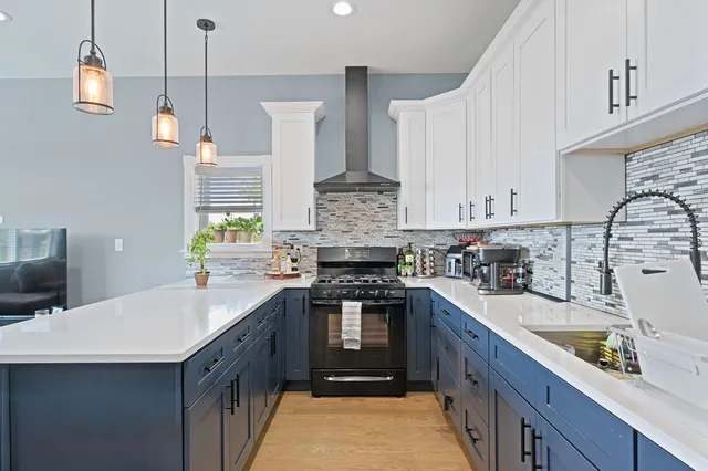 a living room with furniture and kitchen view