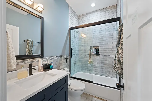 a aerial view of a house with a garden and balcony