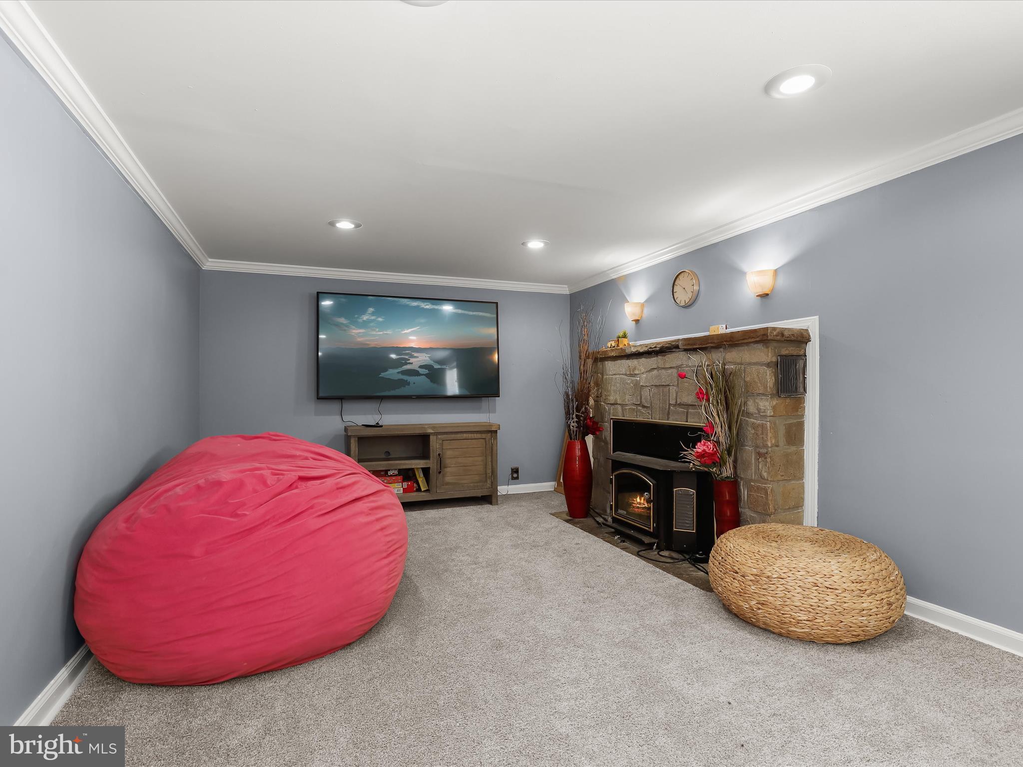 6716 Richardson Road Baltimore, MD 21207 - Photo 19 of 35 Family room with stone fireplace