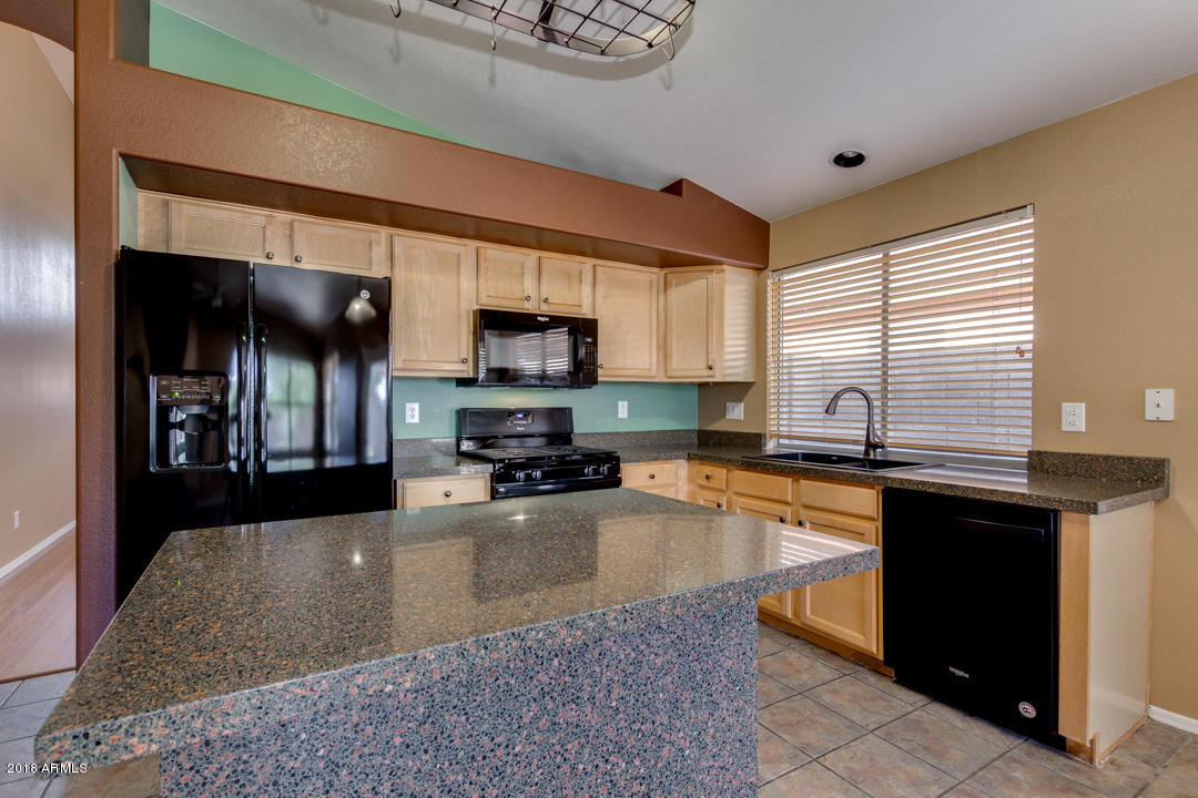 4711 East Jaeger Road Phoenix, AZ 85050 - Photo 12 of 41 Kitchen island with granite apron