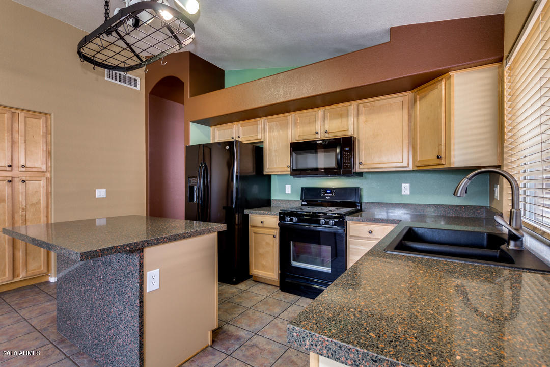 4711 East Jaeger Road Phoenix, AZ 85050 - Photo 13 of 41 Kitchen with pot rack and pantry