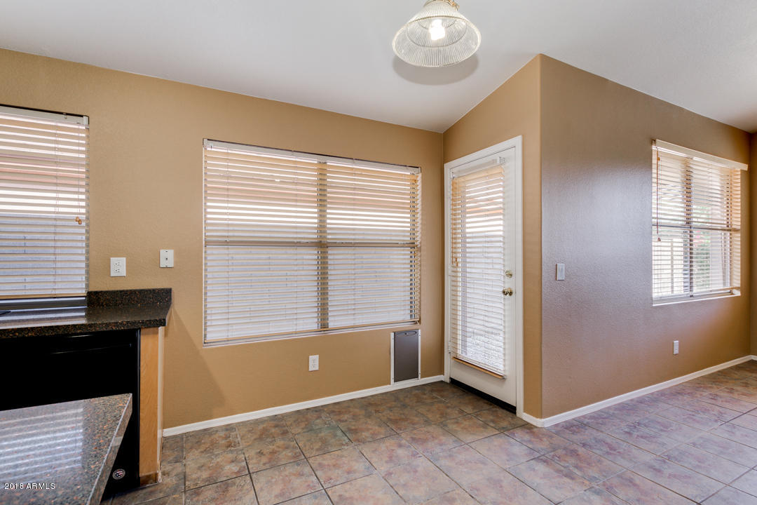 4711 East Jaeger Road Phoenix, AZ 85050 - Photo 15 of 41 Breakfast area with door to backyard