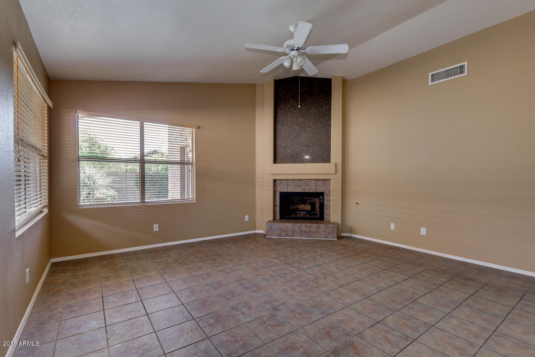 4711 East Jaeger Road Phoenix, AZ 85050 - Photo 18 of 41 Fireplace in family room