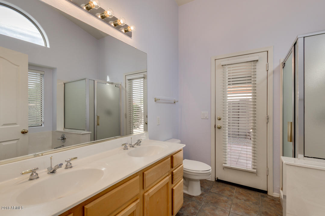 4711 East Jaeger Road Phoenix, AZ 85050 - Photo 29 of 41 Master bedroom with door to the backyard