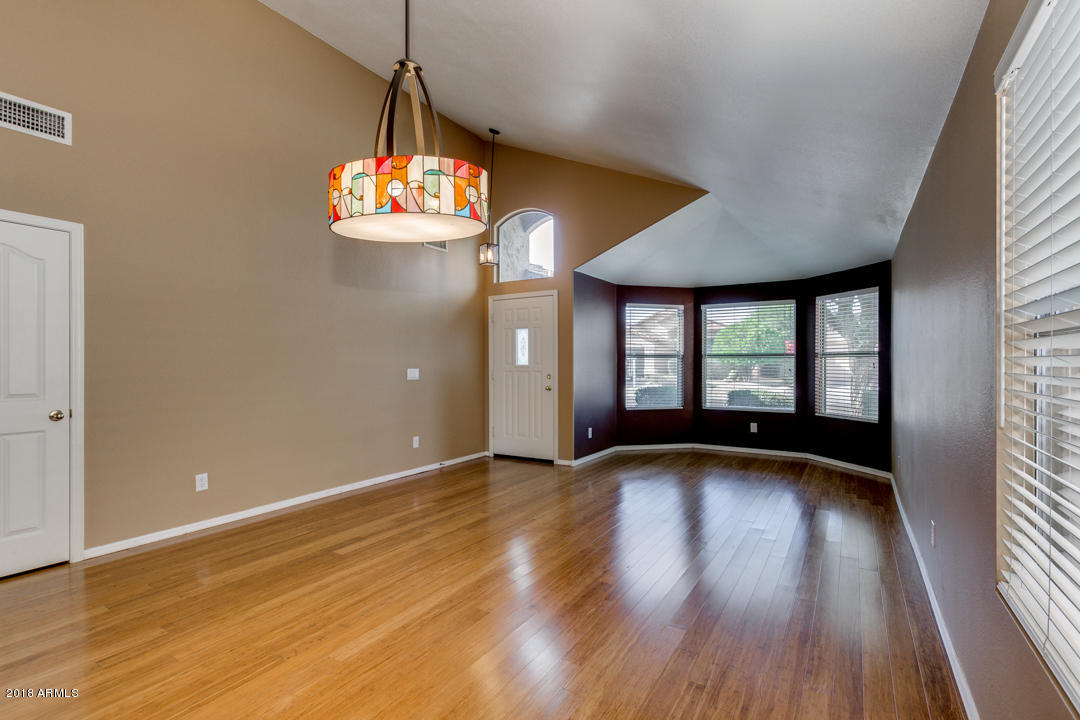 4711 East Jaeger Road Phoenix, AZ 85050 - Photo 6 of 41 Formal living room with vaulted ceilings