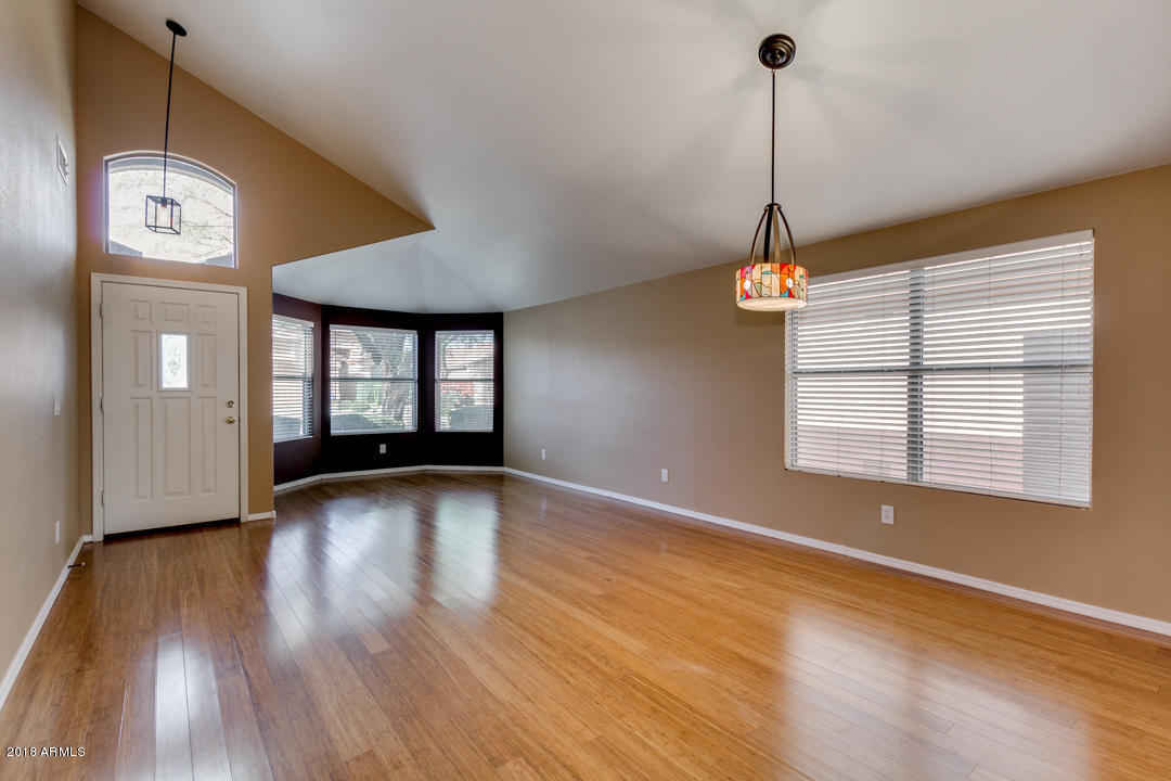4711 East Jaeger Road Phoenix, AZ 85050 - Photo 7 of 41 Living room and front door