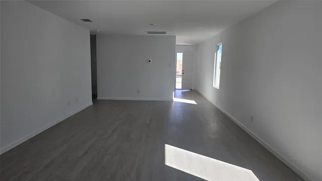 a view of a livingroom with wooden floor