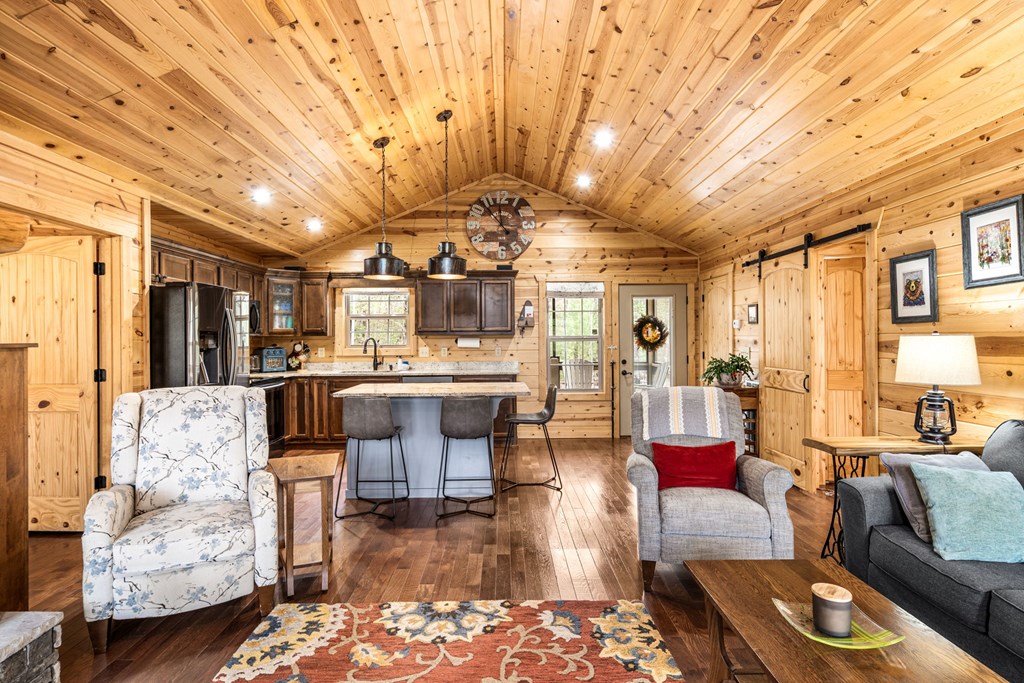 482 Tsalagi Trail Murphy, NC 28906 - Photo 11 of 44 a living room with furniture and a chandelier