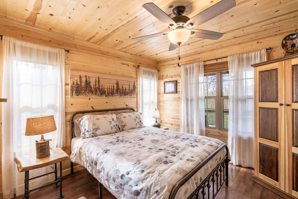 482 Tsalagi Trail Murphy, NC 28906 - Photo 15 of 44 a bedroom with a bed and a window