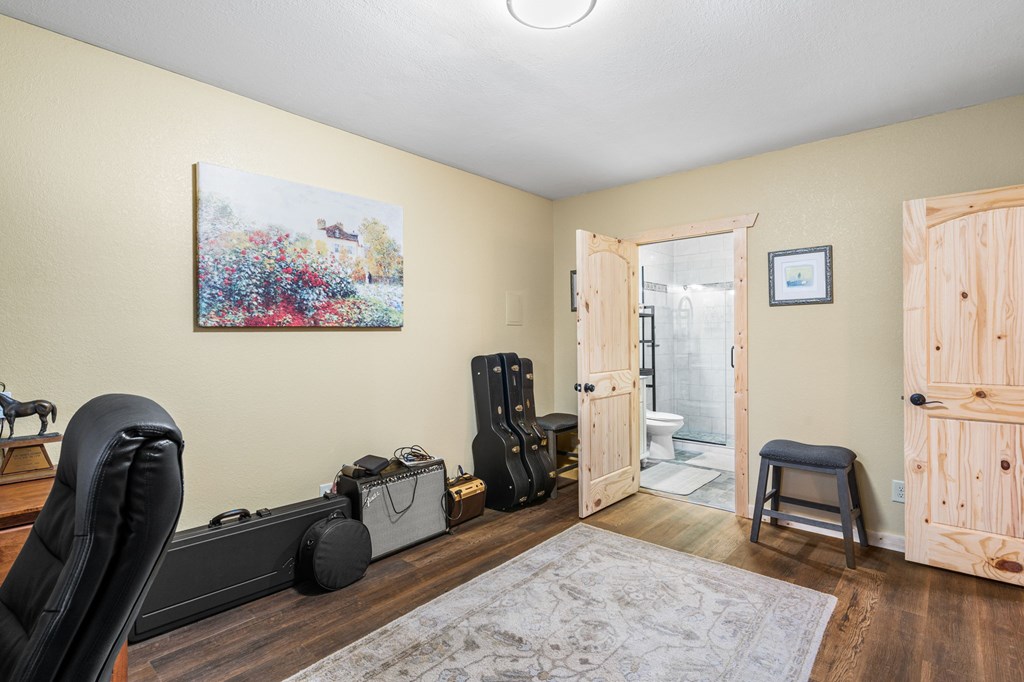 482 Tsalagi Trail Murphy, NC 28906 - Photo 22 of 44 a view of a workspace with furniture and wooden floor