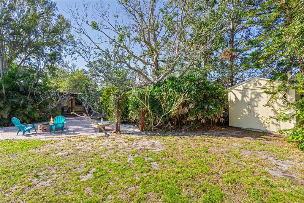 109 Burney Road Osprey, FL 34229 - Photo 40 of 56 Huge back yard with lush landscape and 3rd shed on the right (10 ft x 12 ft)
